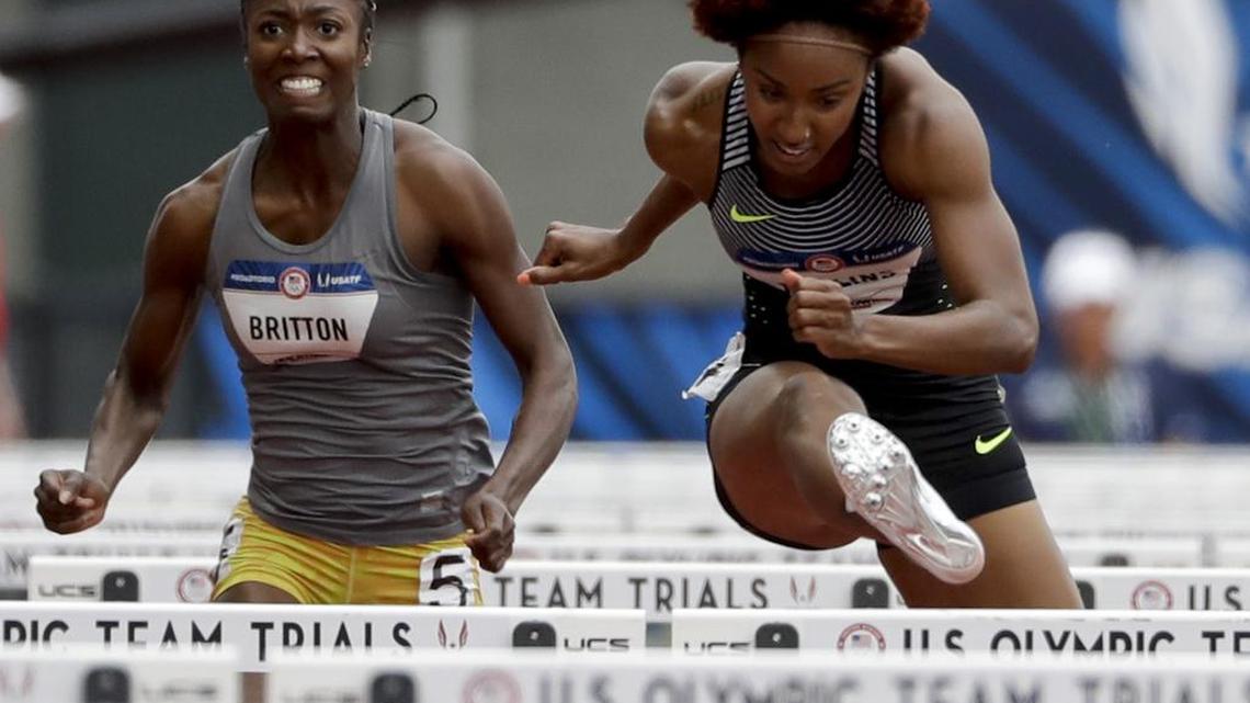 Brianna Rollins, right, wins her heat ahead of Evonne Britton during qualifying for women's 100-meter hurdles at the U.S. Olympic Track and Field Trials, Thurs., July 7, 2016, in Eugene Ore.