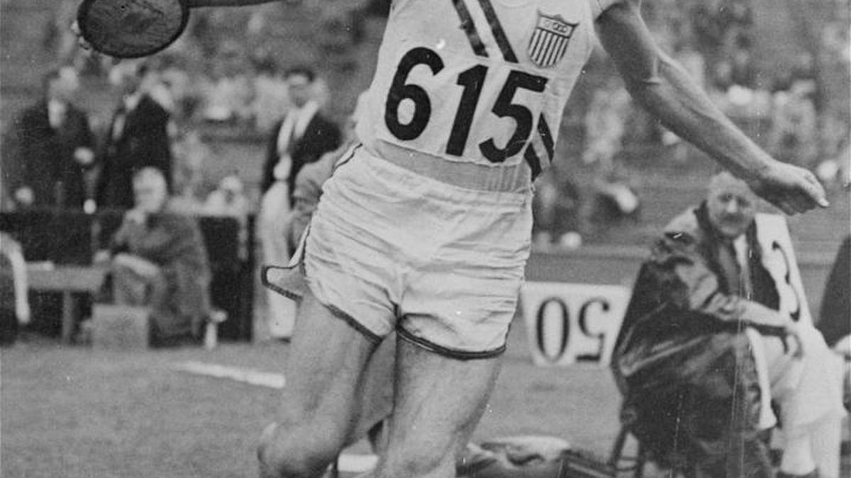 Bob Mathias, Tulare, Calif., high school boy, makes mighty discus toss in Wembley England Stadium August 6, 1948 to take lead in the Decathlon in the London Summer Olympics. Mathias, 17, hurled the discus for a distance of 144 feet 4 inches to top the field. Toss earned him 834 points and boosted his Decathlon total to 5,500 points.