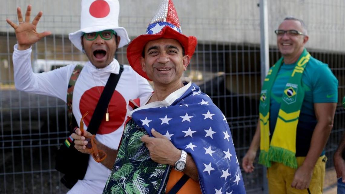 Fans from Japan, United States, and Brazil, from right to left, walk towards Maracana Stadium ahead of the Opening Ceremonies for the 2016 Summer Olympics in Rio de Janeiro on Friday, Aug. 5, 2016.