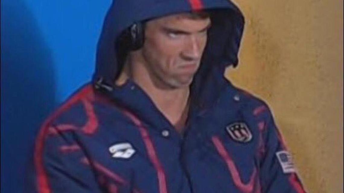 U.S. Olympic swimmer Michael Phelps was making an angry expression when rival South African swimmer Chad le Clos was dancing and shadow boxing in front of him.