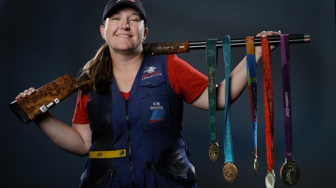 Double trap and skeet shooter Kim Rhode poses for photos with her Olympic medals at the 2016 Team USA media summit in Beverly Hills in March.