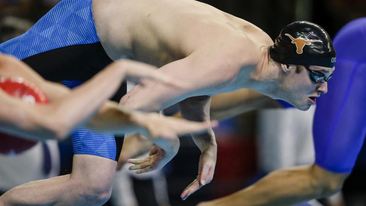 Jack Conger dives at the start of his heat at the U.S. Olympic swimming trials in Omaha, Neb., in July. USOC spokesman Patrick Sandusky said that "Jack Conger and Gunnar Bentz were removed from their flight to the United States by Brazilian authorities. We are gathering further information."