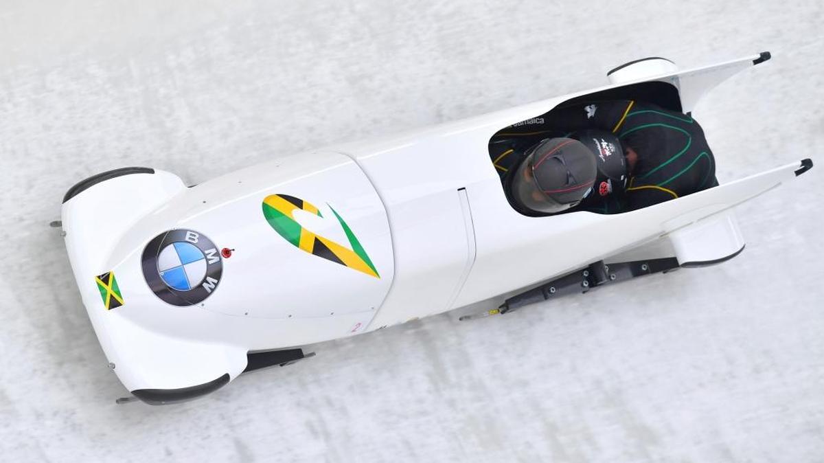 Jazmine Fenlator-Victorian and Carrie Russell of Jamaica speed down the track during their first run of the women's bobsled World Cup race in December.