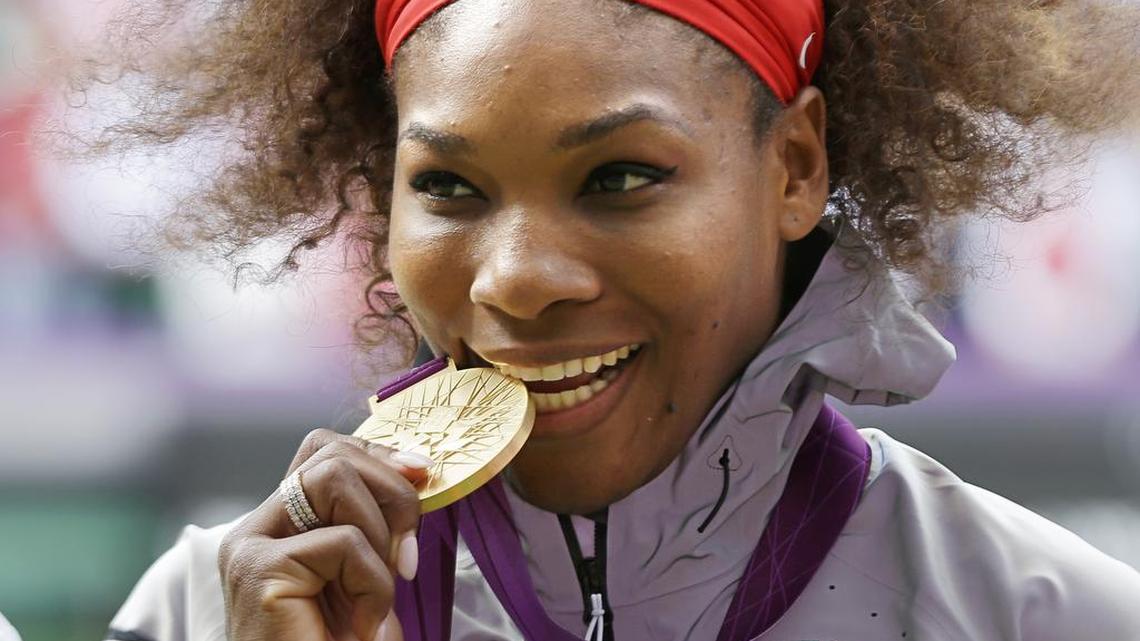 Serena Williams poses with the gold medal she won for women’s singles at the 2012 Summer Games in London.
