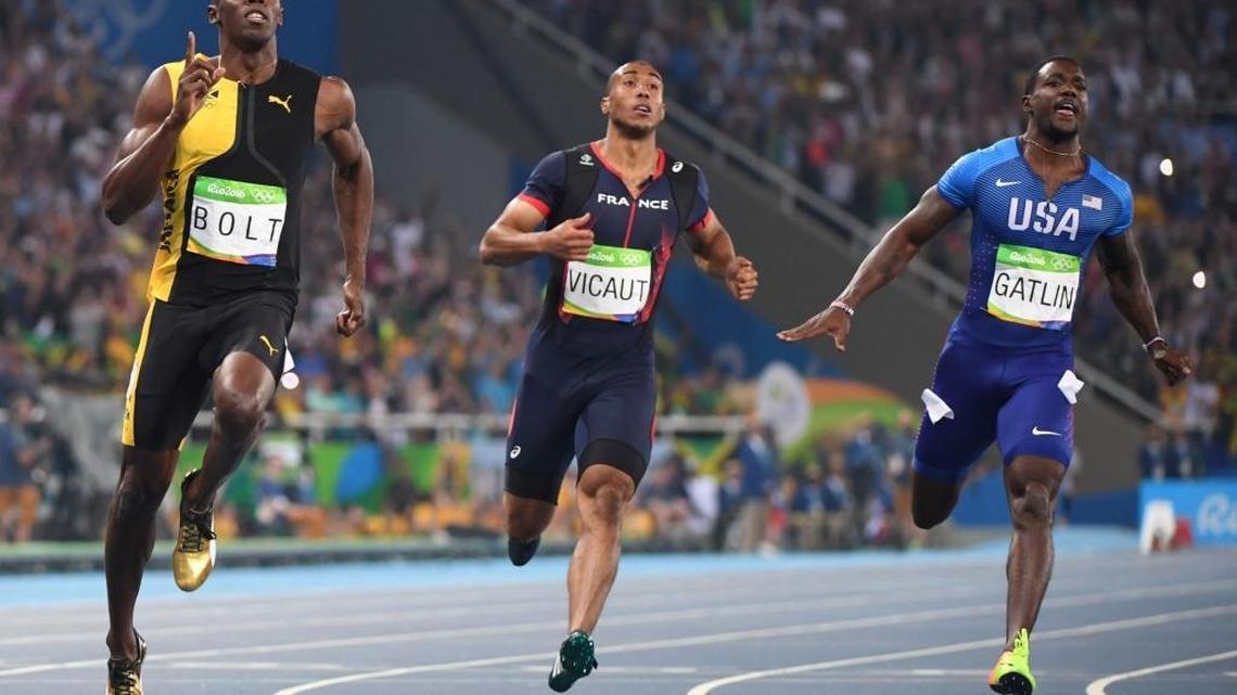 Jamaica’s Usain Bolt (left) crosses the finish line to win the 100-meter final Sunday in Rio de Janeiro. Bolt is also favored to win the 200, and if he and his teammates can win the 4x100 relay Friday night, he will realize his goal of a “triple-triple” — winning gold in the 100, 200 and relay for three straight Olympics.
