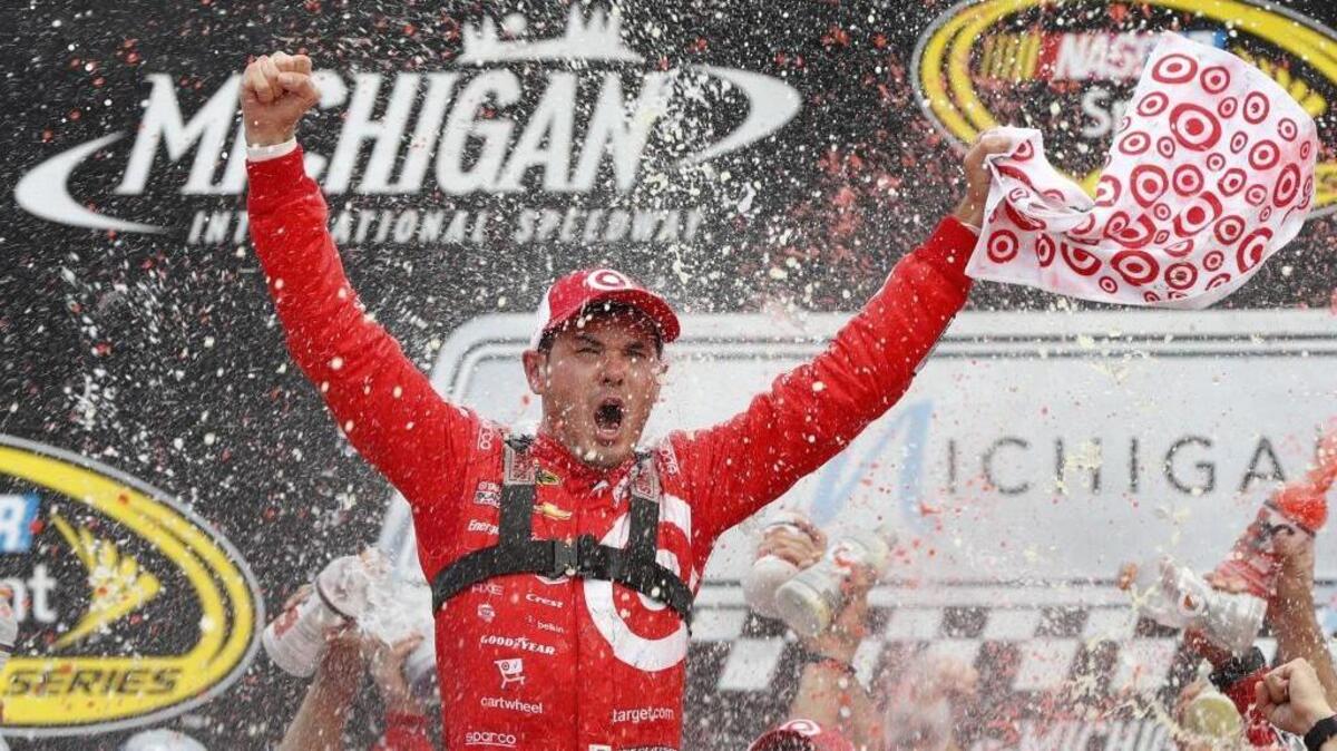 Kyle Larson celebrates after winning the NASCAR Sprint Cup Series auto race at Michigan International Speedway in Brooklyn, Mich., Sunday, Aug. 28, 2016.