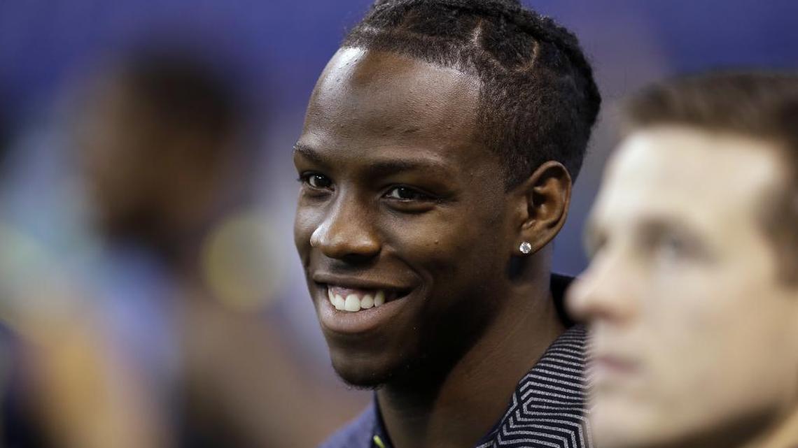 Washington wide receiver John Ross watches during a drill at the NFL football scouting combine Saturday, March 4, 2017, in Indianapolis.