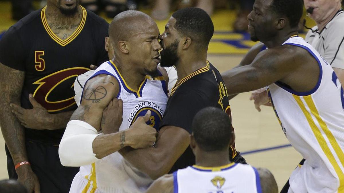 Cleveland Cavaliers center Tristan Thompson, center right, confronts Golden State Warriors forward David West during the first half of Game 5 of basketball's NBA Finals in Oakland, Calif., Monday, June 12, 2017.