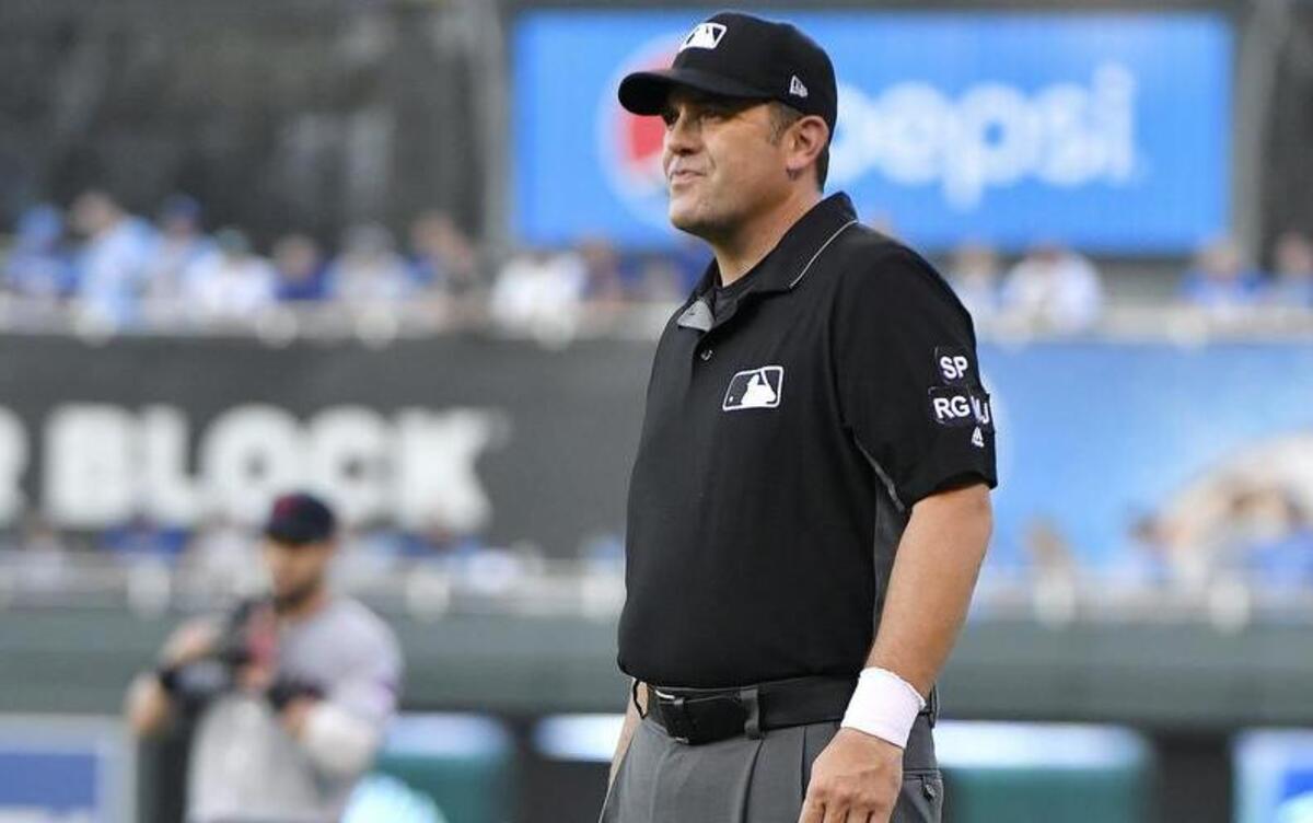 First base umpire Brian Knight wore a white wristband during the Royals’ game at Kauffman Stadium to draw attention to a protest by umpires around baseball. The umpires’ union decried “escalating attacks on umpires” by players.