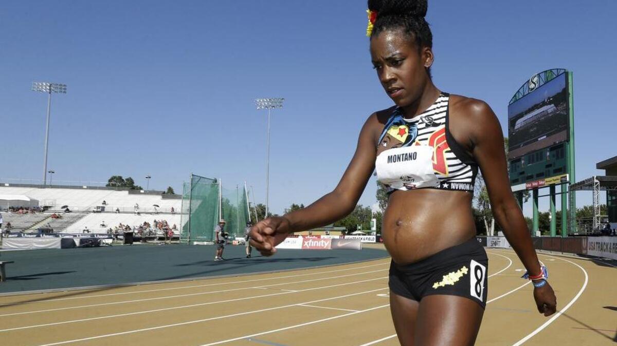 Alysia Montano, who is five months pregnant, walks to the starting line for a heat in the first round of the women's 800 meters at the U.S. Track and Field Championships, Thursday, June 22, 2017, in Sacramento, Calif.