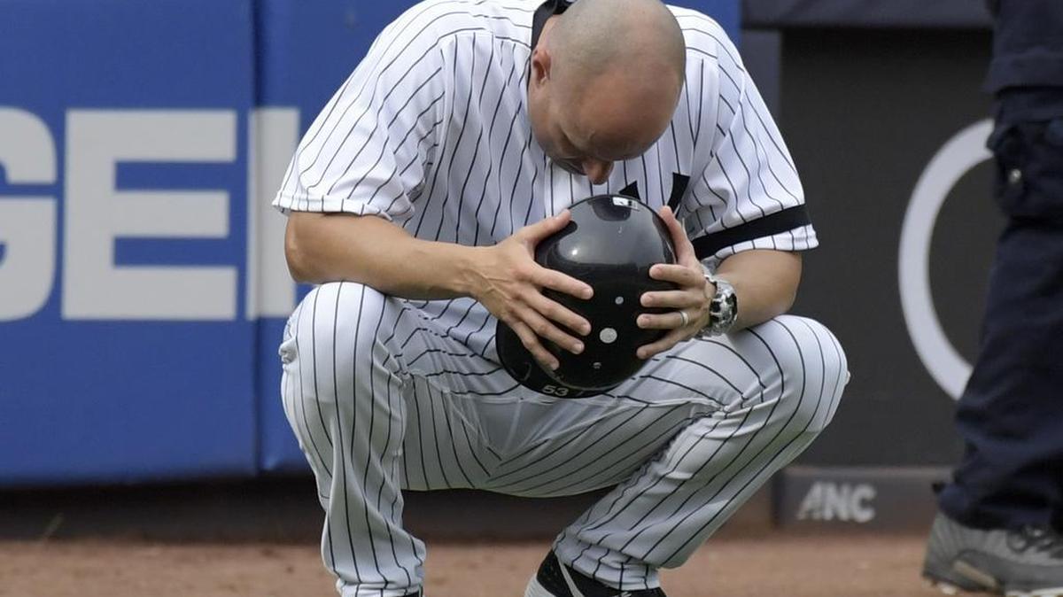 New York Yankees third base coach Joe Espada reacts after a young girl was hit by a line drive during the fifth inning of a baseball game against the Minnesota Twins Wednesday, Sept.20, 2017, at Yankee Stadium in New York.