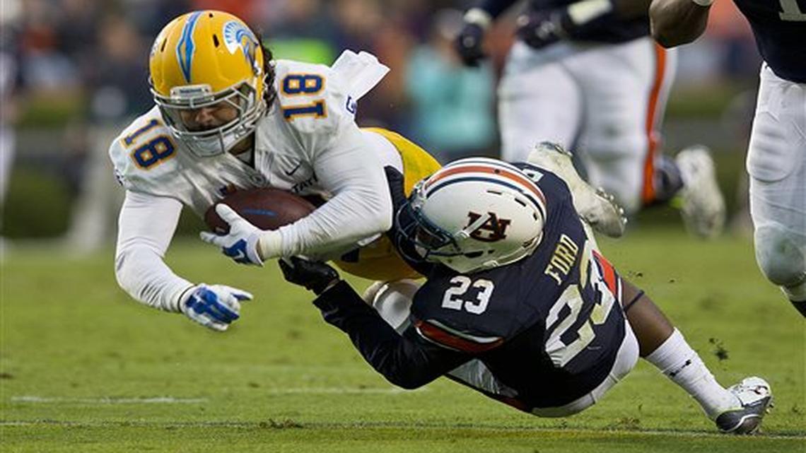 Auburn defensive back Johnathan Ford (23) tackles San Jose State tight end Billy Freeman (18) during the second half of an NCAA college football game, Saturday, Oct. 3, 2015, in Auburn, Ala. Auburn won 35-21.