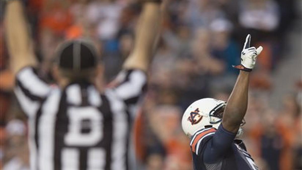 Auburn wide receiver Ricardo Louis (5) celebrates after catching a touchdown pass against Idaho during an NCAA college football game Saturday, Nov. 21, 2015, in Auburn, Ala.