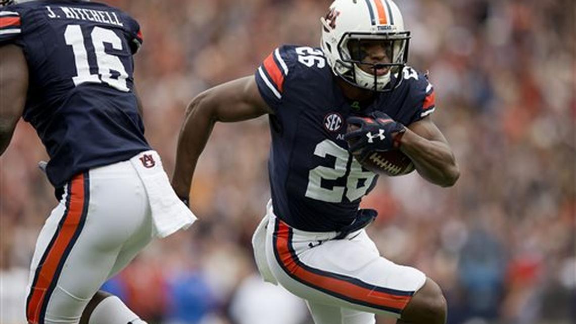 Auburn linebacker Justin Garrett (26) runs an interception during the first half of an NCAA college football game against San Jose State, Saturday, Oct. 3, 2015, in Auburn, Ala.