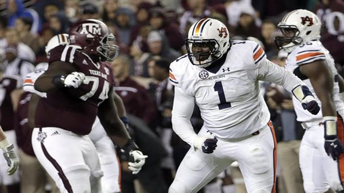 Auburn defensive tackle Montravius Adams (1) celebrates after sacking Texas A&M quarterback Kyler Murray, bottom, during the second quarter of an NCAA college football game Saturday, Nov. 7, 2015, in College Station, Texas.